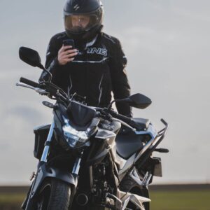 motorcycle rider making phone call
