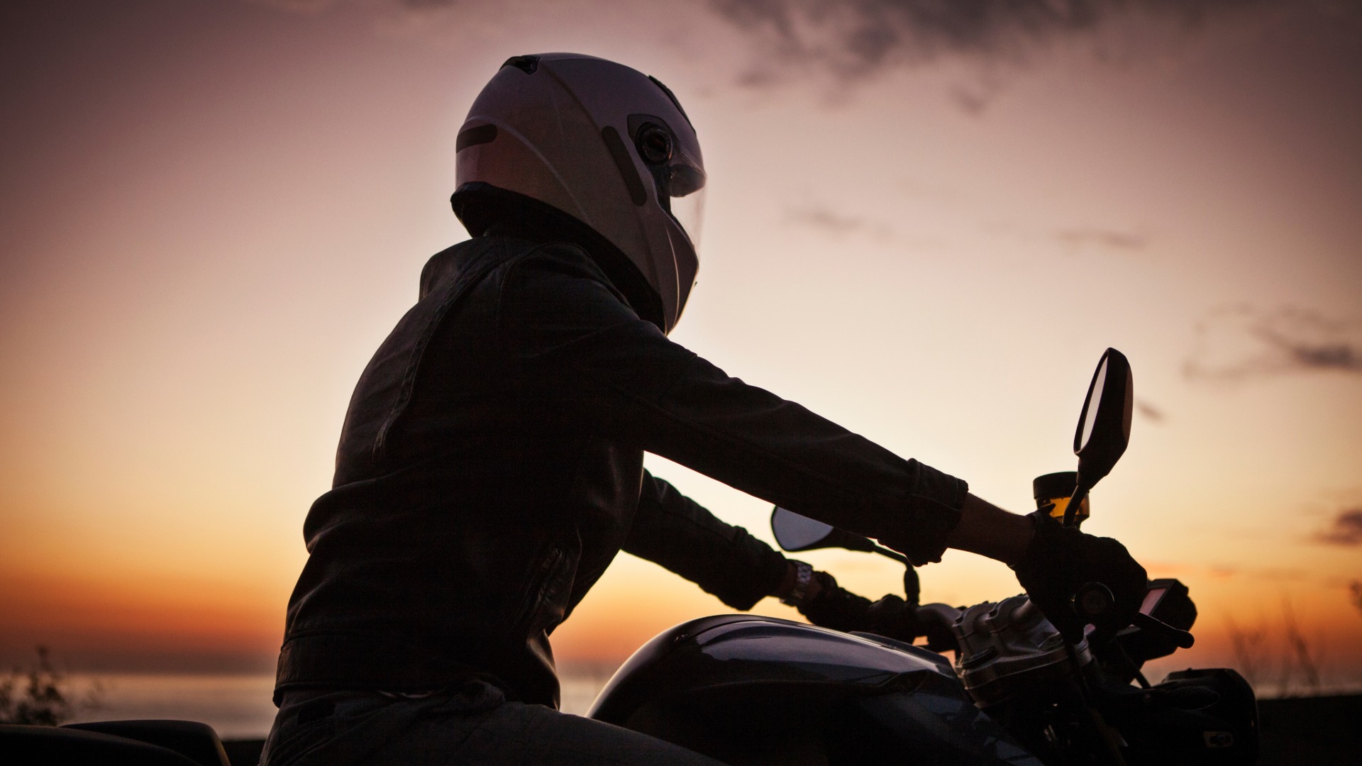 motorcycle rider in the sunset