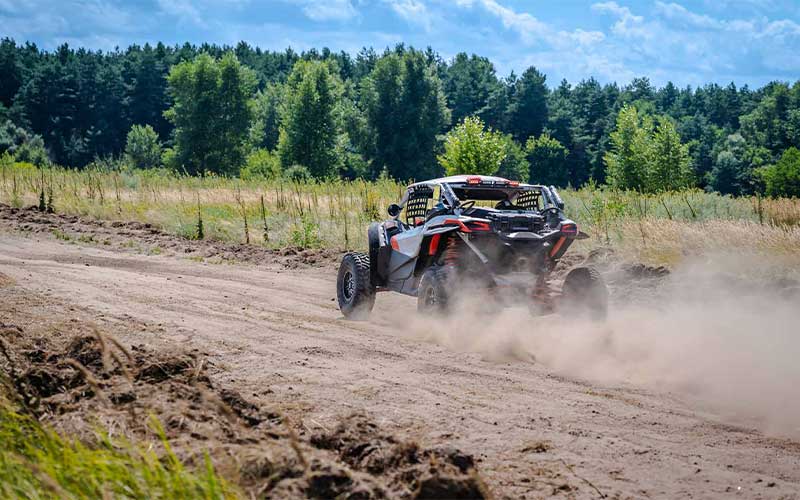 ATV going down dusty road