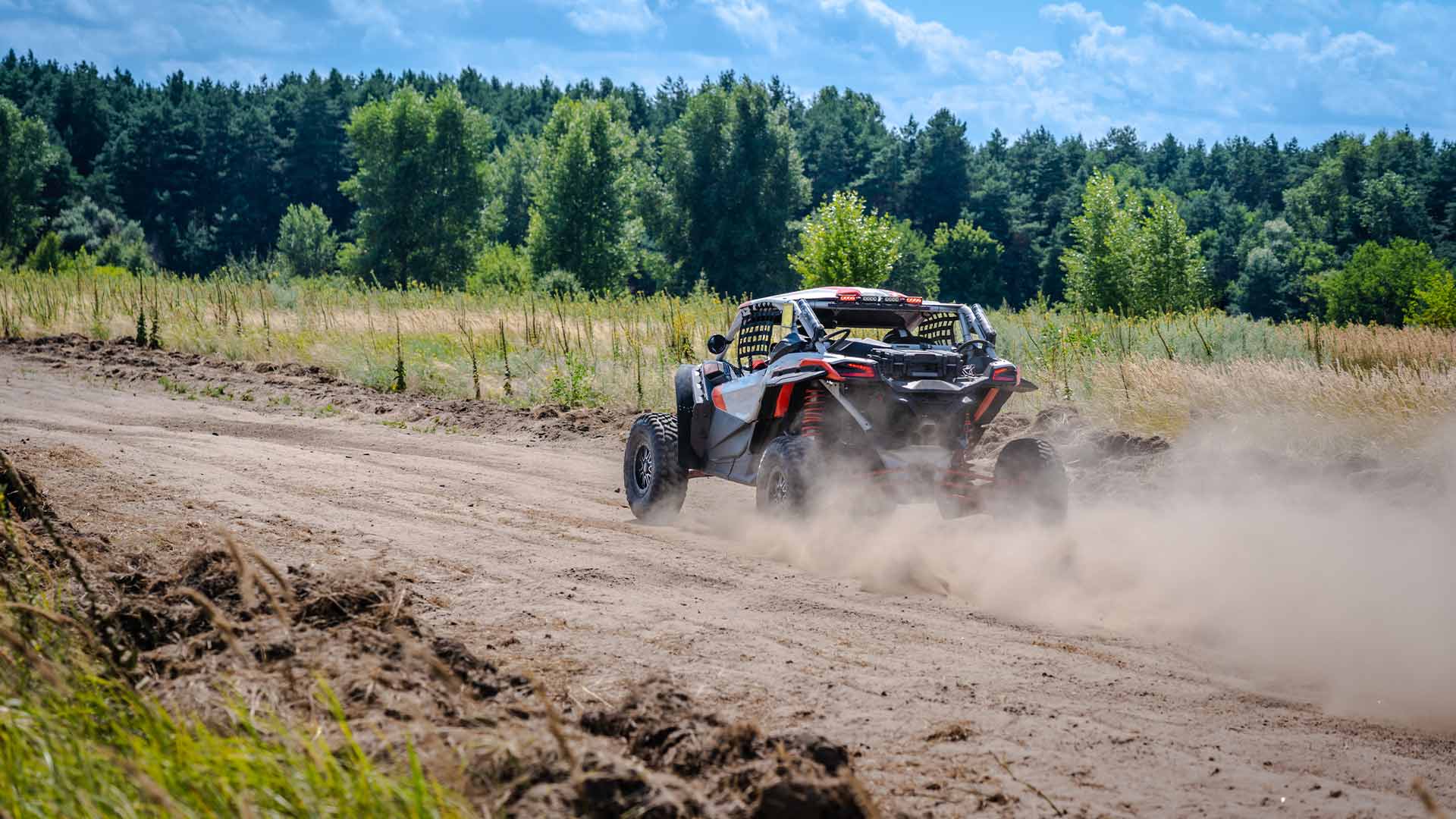 ATV going down a dusty road