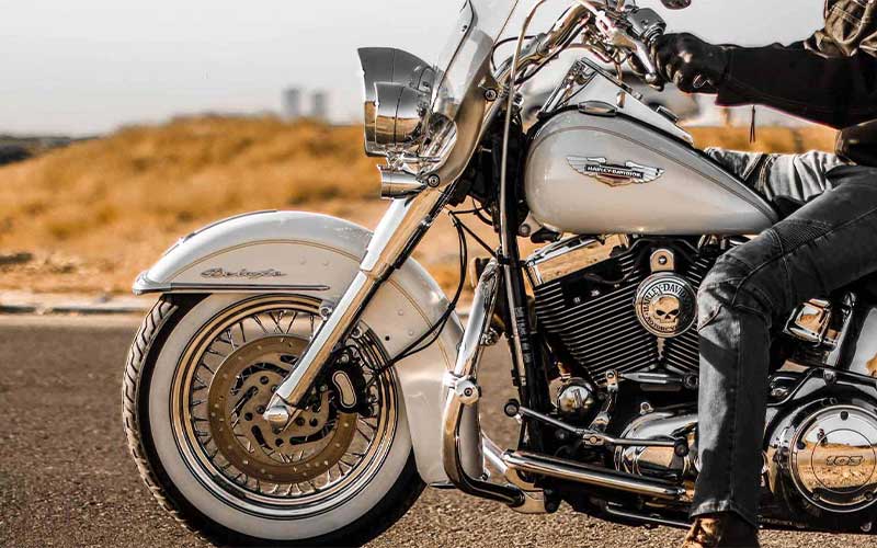 Man on white Harley Davidson