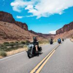 Motorcycle riders going down the road